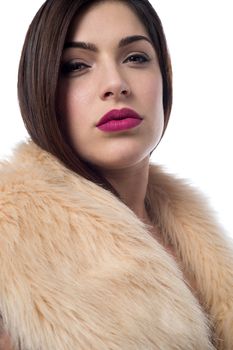 Pretty trendy woman in luxurious fur coat