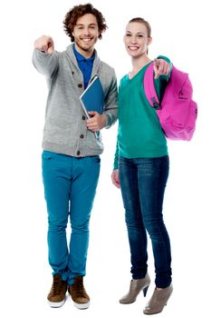 Cheerful classmates pointing finger to camera