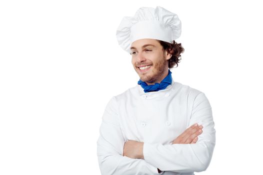 Confident male chef looking at copy space