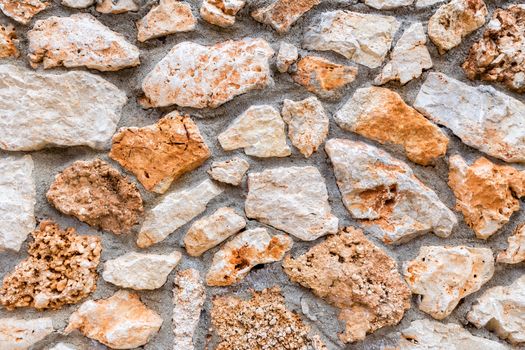 Background of stony wall with cement as fence in Greece