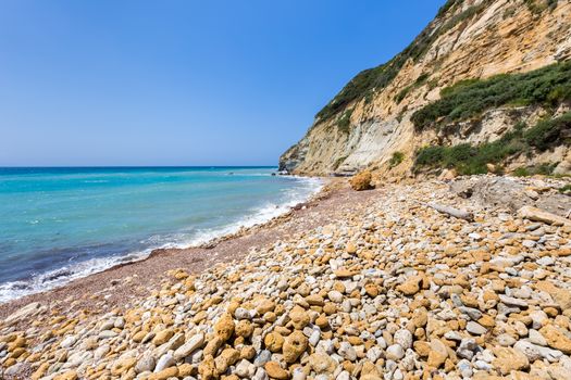 Coast landscape with stony beach, mountain and blue sea in Kefalonia Greece