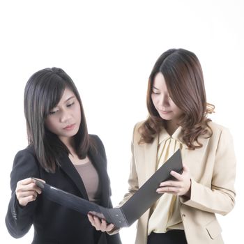 Two asian business woman in office, discussing profile