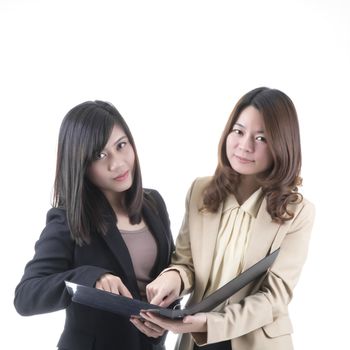 Two asian business woman in office, discussing profile