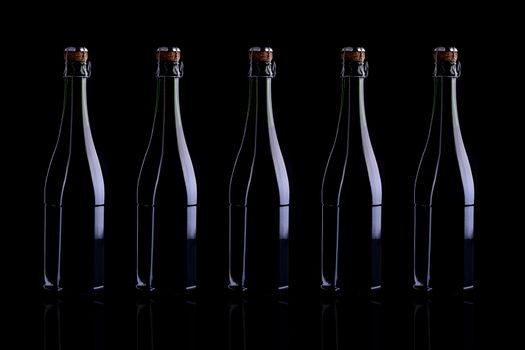 Wine bottle, still life profile, isolated on black background