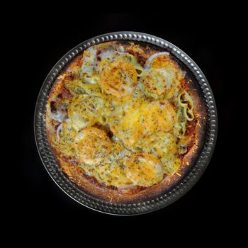 Freshly baked rustic pizza isolated over black background