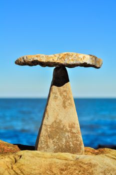 Balancing of stones each other on the coast