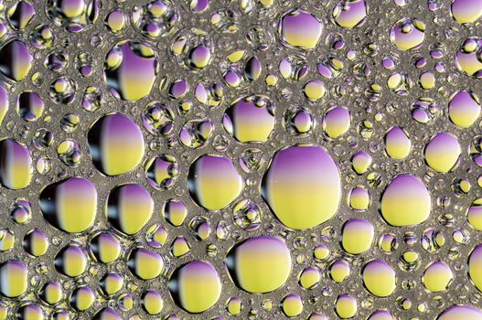 Abstract Colorful reflections on oil and soap bubbles in water