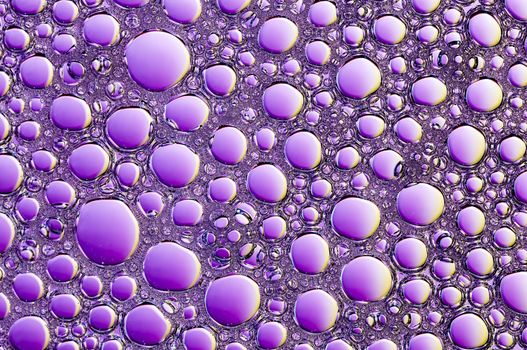 Abstract Colorful reflections on oil and soap bubbles in water