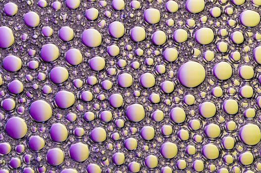 Abstract Colorful reflections on oil and soap bubbles in water