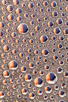 Abstract Colorful reflections on oil and soap bubbles in water