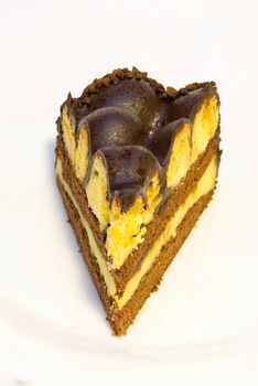 a piece of isolated vanilla and chocolate cake