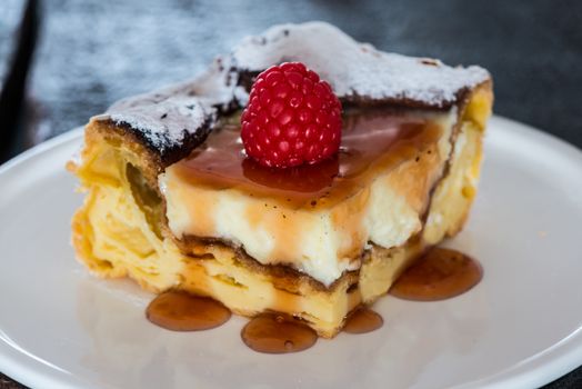 eclair cake with pudding and raspberry