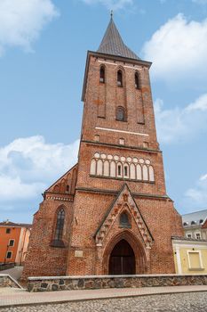 View of Evangelist Lutheran St John's Church in Tartu, Estonia from the 14th century, on coludy blue sky bakcground.