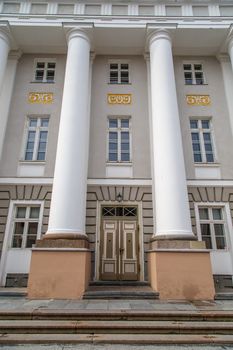 TARTU, ESTONIA - APRIL 27, 2015 : Close up front view of Tartu University, estblished in 1632, today a public university with 18.000 students, in Tartu, Estonia.