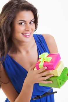 Young beautiful woman with box on isolated studio bakground