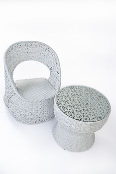 Suite of wicker furniture made of synthetic fibre on isolated background
