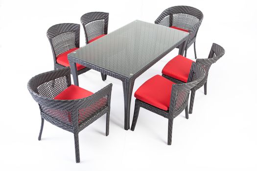 Suite of wicker furniture made of synthetic fibre on isolated background