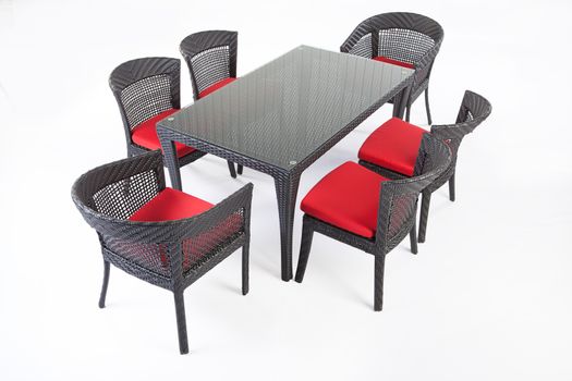 Suite of wicker furniture made of synthetic fibre on isolated background