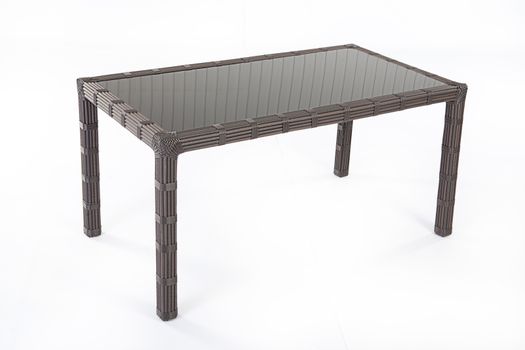 Wicker table made of synthetic fibre on isolated background