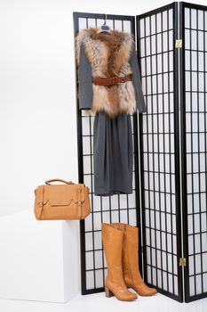 Woman's clothing hanging on the folding screen