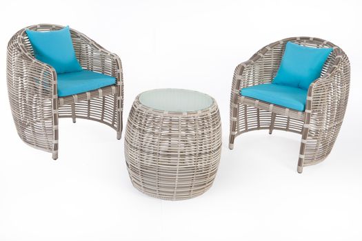 Suite of wicker furniture made of synthetic fibre on isolated background