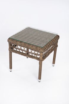 Wicker table made of synthetic fibre on isolated background