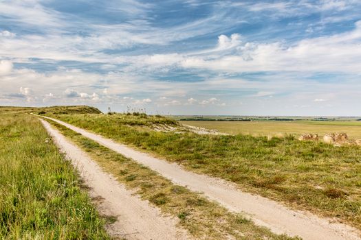 ranch road over prairie in eastern Kansas near Castle Rock, summer scenery,