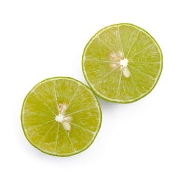 Juicy slices of lime isolated on white background.