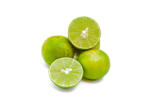 Juicy slices of lime isolated on white background.