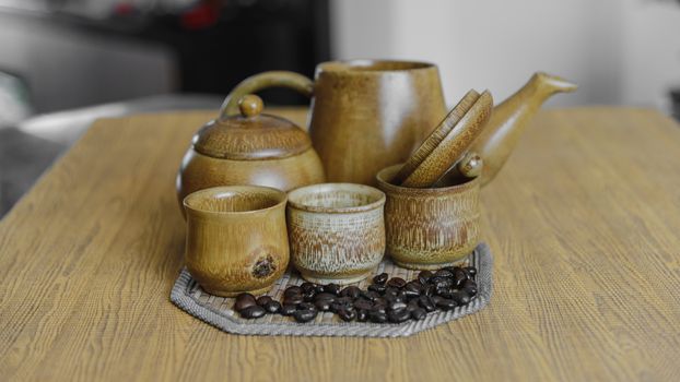 Soft focus image of coffee beans and coffee cups set on wooden background.Vintage style.(soft focus)