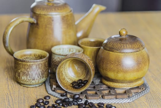 Soft focus image of coffee beans and coffee cups set on wooden background.Vintage style.(soft focus)