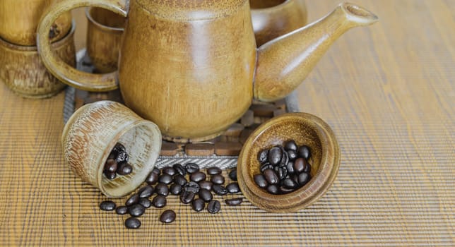 Soft focus image of coffee beans and coffee cups set on wooden background.Vintage style.(soft focus)