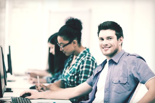 education concept - student with computer studying at school