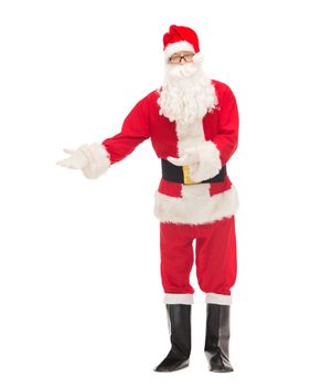 christmas, holidays, gesture and people concept - man in costume of santa claus