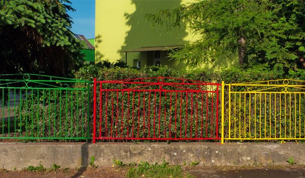 Colorful metal fence at school yard