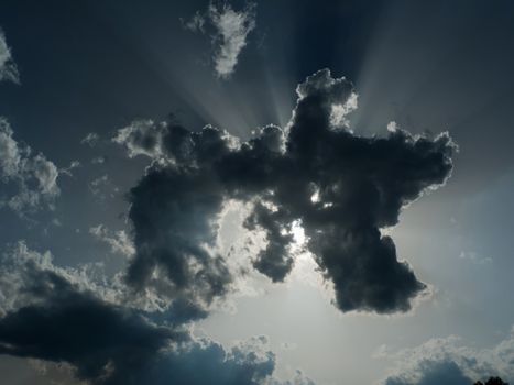 Stormy cloud with sun and sun rays
