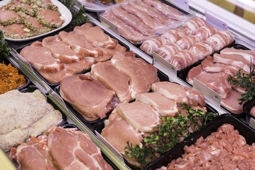 fresh meat like ham bacon sausages and other in buther shop