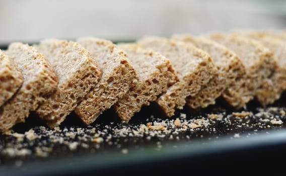 Sliced homemade bread in tray close up shot