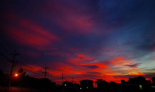 Nice sunset light shine on the sky with city silhouette