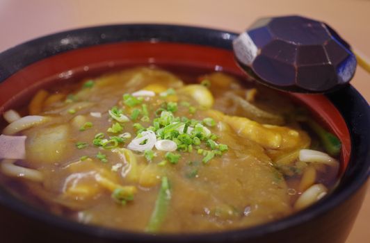 Japanese noodle curry soup on table, Close up shot