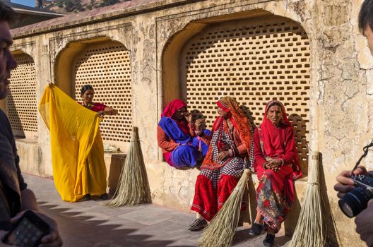 Jaipur, India - December 29, 2014: Indian Women with Traditional Dress at Amber Fort near Jaipur, Rajasthan, India on December29, 2014. The Fort was built by Raja Man Singh I.