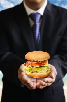 Businessman share food (Hamburger), Share food concept