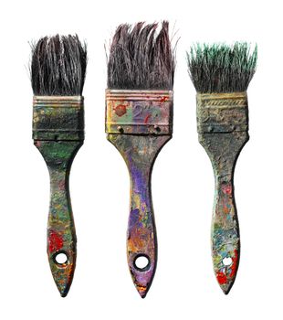 Old dirty paint brushes isolated on white.