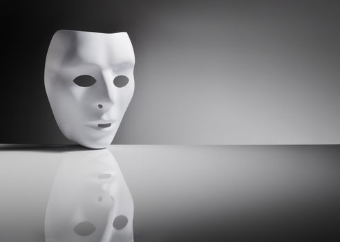 White plastic mask on reflective surface.