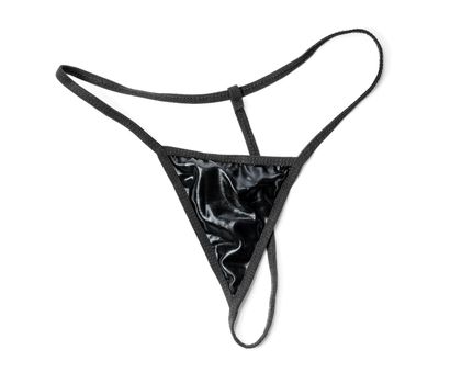 Tiny black thong isolated on white with natural shadows.