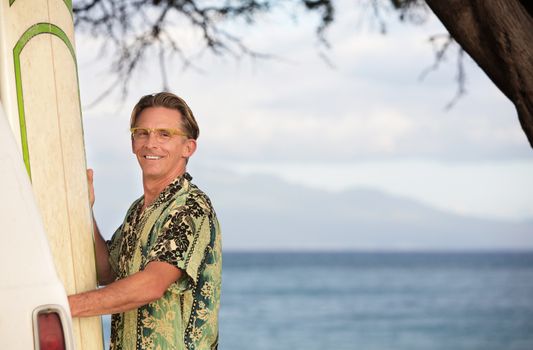 Single male surfer with surfboard and copy space