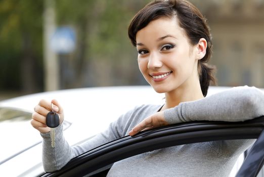 Pretty girl showing the car key