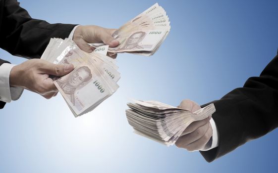 Businessman carry Thai money for invest, Fund management concept
