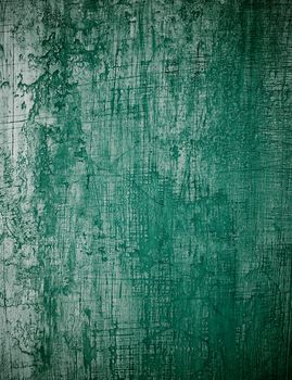 Dark Green Obsolete Cement Wall Background closeup. Vertical View