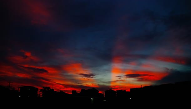 Nice sunset light shine on the sky with city silhouette